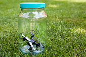 quadcopter glass jar grass background nobody