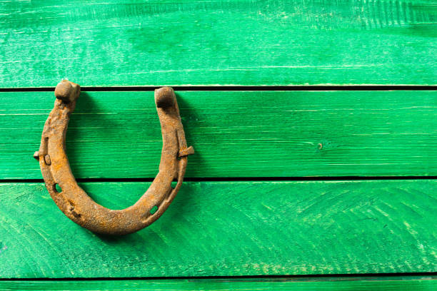 istock old rusty horseshoes on wooden board 1154584239