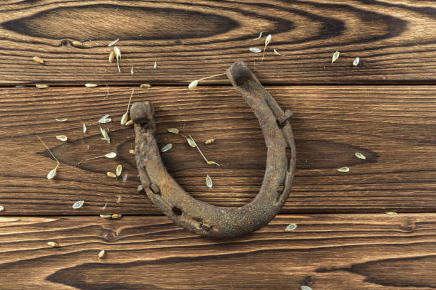 istock old rusty horseshoes on wooden board 1154584632