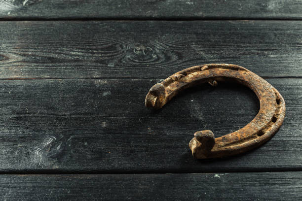 istock old rusty horseshoes on wooden board 1154585036