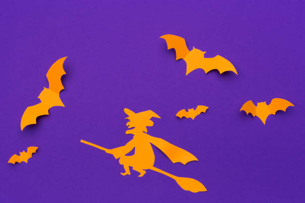istock halloween and decoration concept - paper bats flying 1154585862
