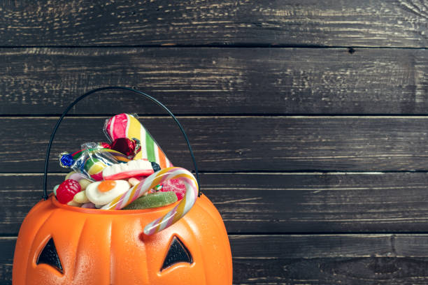 istock Happy halloween! Pumpkin with candy in the home. 1154586167