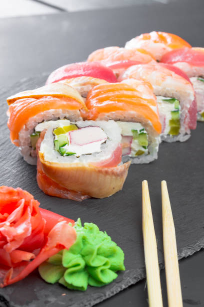 istock Japanese restaurant, sushi roll on black slate plate. 1154587481