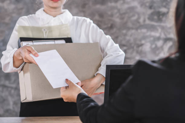 female worker hand giving resignation latter to boss quitting a job female worker hand giving resignation latter to boss quitting a job being fired stock pictures, royalty-free photos & images