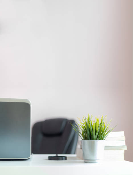 istock Fresh green grass on the office desk with copy space 1154590083