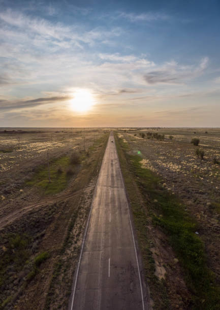 istock Empty asphalt road goes into the distance on sunset 1154591728