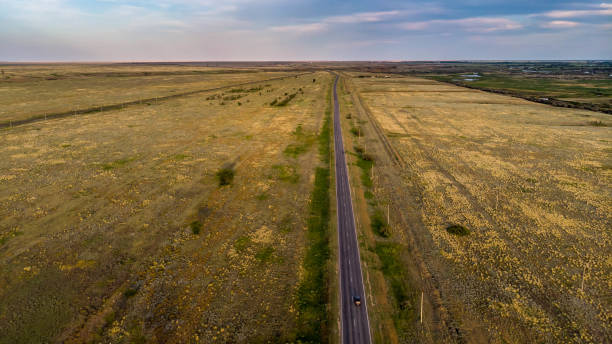 istock Empty asphalt road goes into the distance 1154591749
