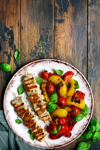 Grilled chicken skewers kebab with roasted vegetables