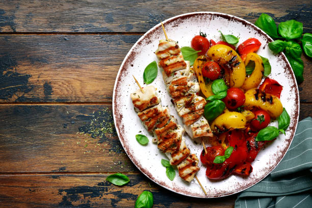 Grilled chicken skewers kebab with roasted vegetables