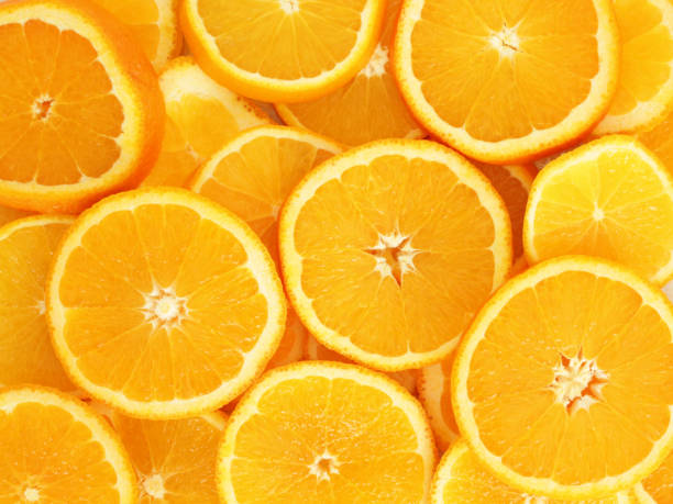 istock Heap of fresh orange slices 1154593004