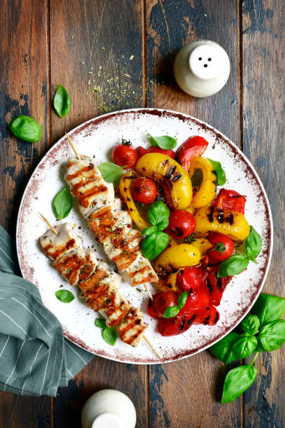 Grilled chicken skewers kebab with roasted vegetables