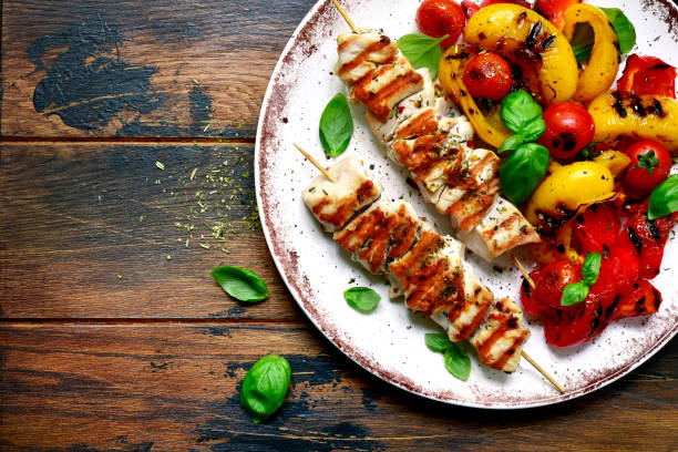 Grilled chicken skewers kebab with roasted vegetables