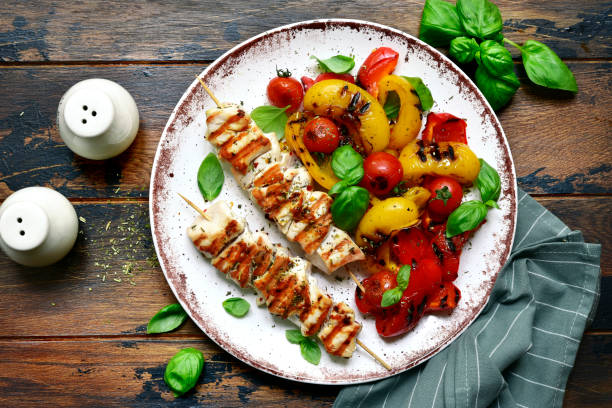 Grilled chicken skewers kebab with roasted vegetables