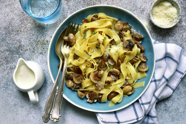 istock Tagliatelle pasta with fried mushrooms 1154593077