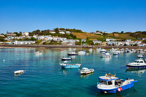 Image of Gorey Harbour, Jersey C.I. with pleasure and fissing boats in the sunshine.