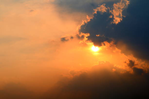 istock sunset, orange sky sun sets over cloud dark, gold sky sun lighten clouds evening 1154595369