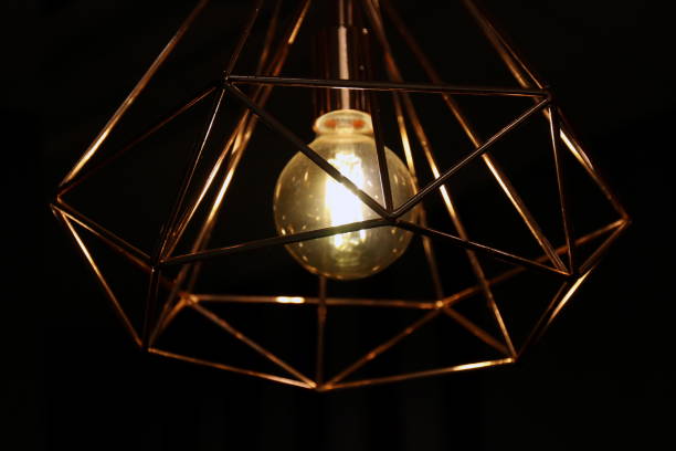 istock modern lighting hanging, lamp modern on dark background 1154596541
