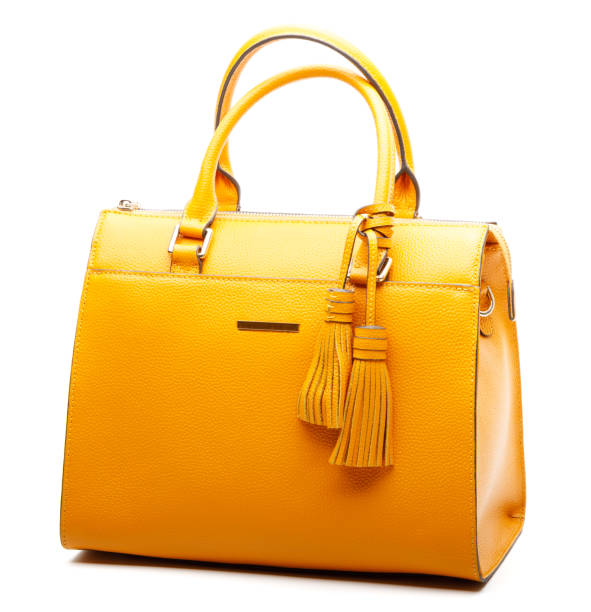 gelber handtasche - isolated on yellow stock-fotos und bilder