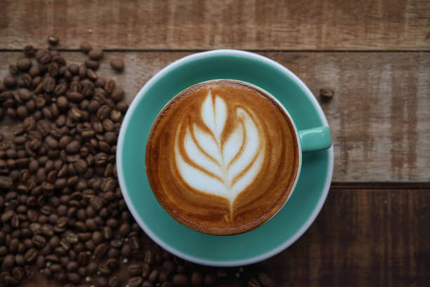 istock hot Coffee in coffee cup on wooden table in cafe 1154599097