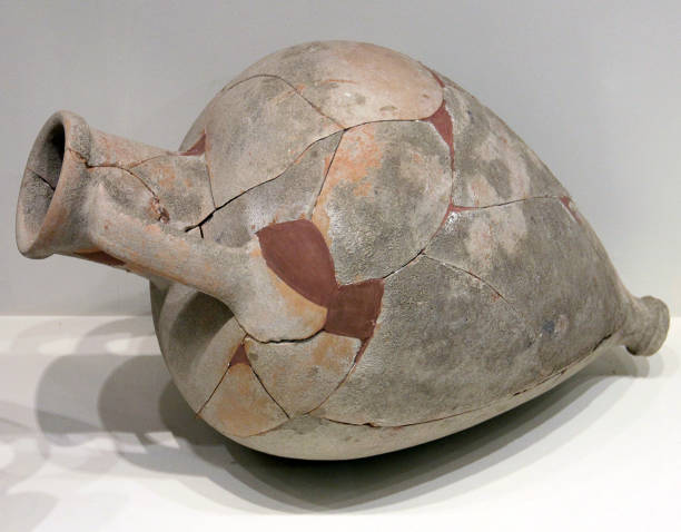 Greek amphorae hung in decorative arrangement