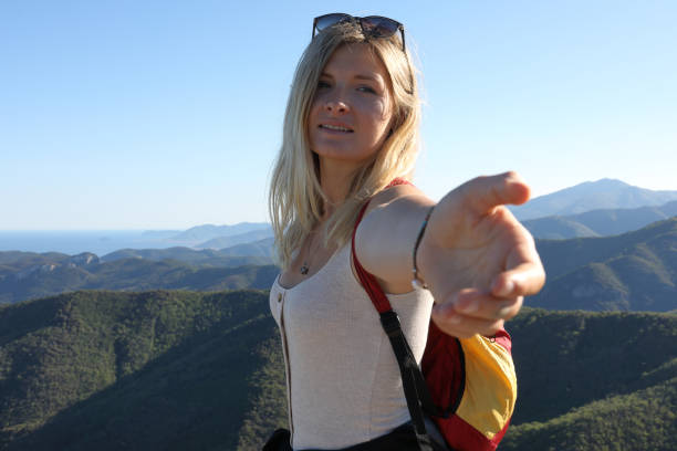 Mountain range behind her