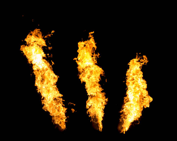 three fire jets isolated on black background, flame stream - flamethrower imagens e fotografias de stock