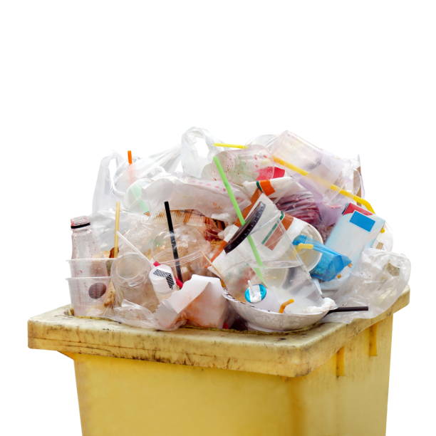 istock Waste heap, Waste Garbage trash plastic full of trash bin yellow, Plastic bag waste Lots of junk isolated on white background, Garbage many close-up 1154607782