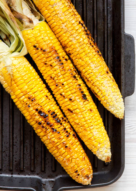 istock Grilled corn on the cob in a grilling pan, top view. From above, overhead. Closeup. 1154614947