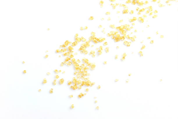 istock granulated sugar abstract background, sugarcane sugar, sugar, brown sugar abstract on white background, sugarcane (selective focus), sugarcane agriculture 1154615215