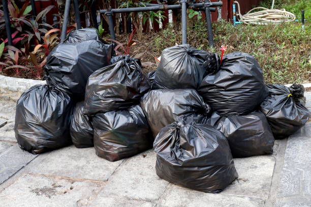 istock Waste plastic, Lots pile of garbage black bags stack on the floor ground public park, many dump black garbage plastic bags stack 1154615566