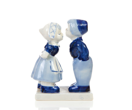 Typical Dutch souvenir in Delft blue over white background