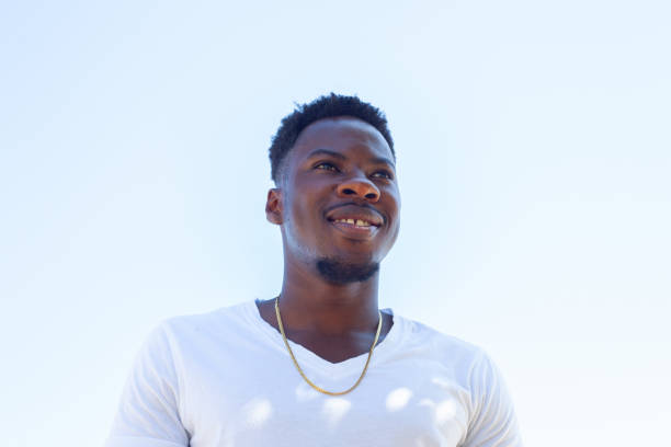 istock Calm afro American man looking camera with serious and happy expression 1154617373