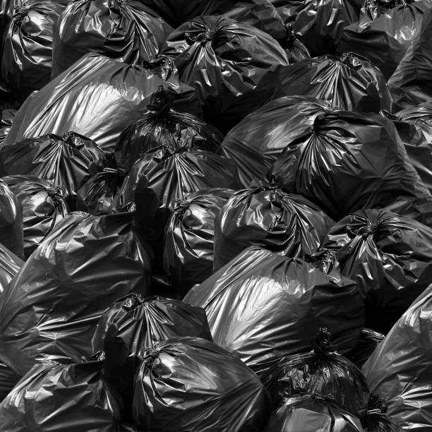istock Waste background garbage bag black bin, Garbage dump, Bin,Trash, Garbage, Rubbish, Plastic Bags pile junk garbage Trash texture 1154618073