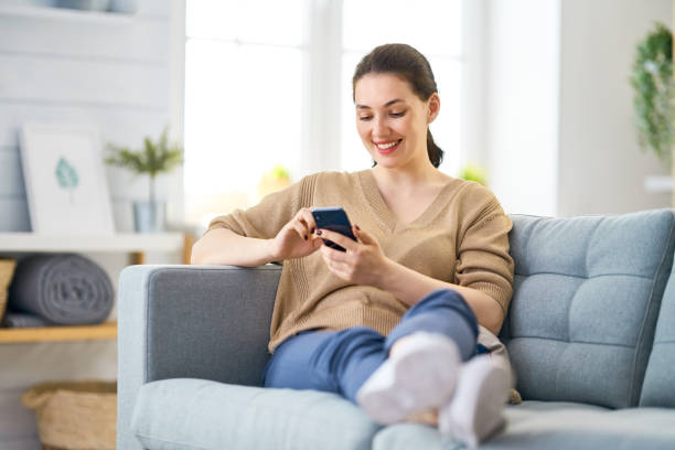 istock woman with phone 1154620115