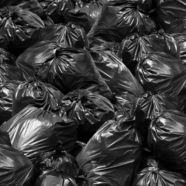 istock Waste background garbage bag black bin, Garbage dump, Bin,Trash, Garbage, Rubbish, Plastic Bags pile junk garbage Trash texture 1154620378