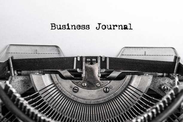 istock Business journal, text is typed on an old vintage typewriter with white paper. 1154623004