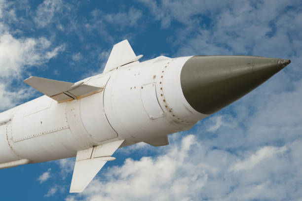 istock A missile with a warhead against the sky and clouds. 1154623110