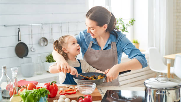 istock Happy family in the kitchen. 1154623222
