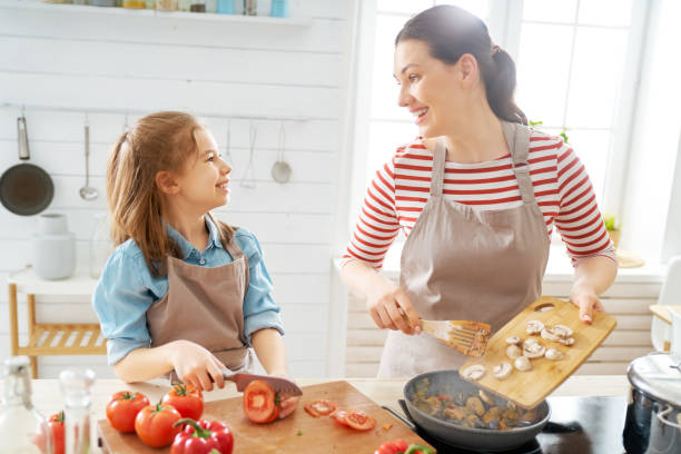 istock Happy family in the kitchen. 1154623228