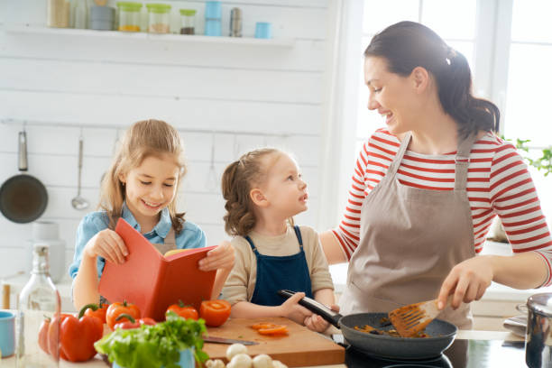 istock Happy family in the kitchen. 1154623243