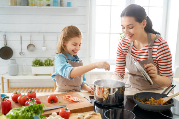 istock Happy family in the kitchen. 1154623262