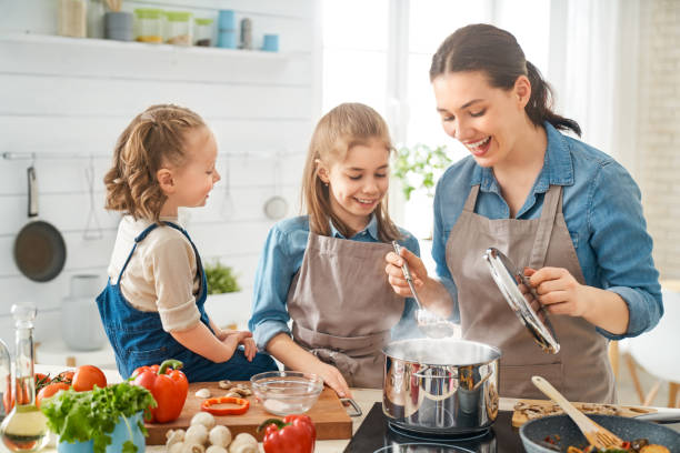istock Happy family in the kitchen. 1154623267