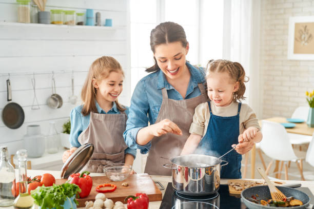 istock Happy family in the kitchen. 1154623274