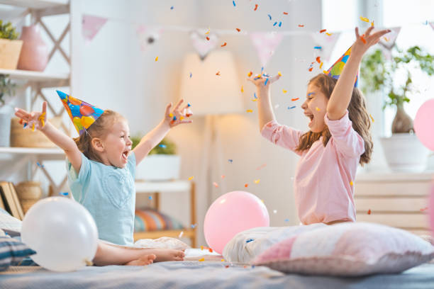istock Girls are throwing confetti 1154624262