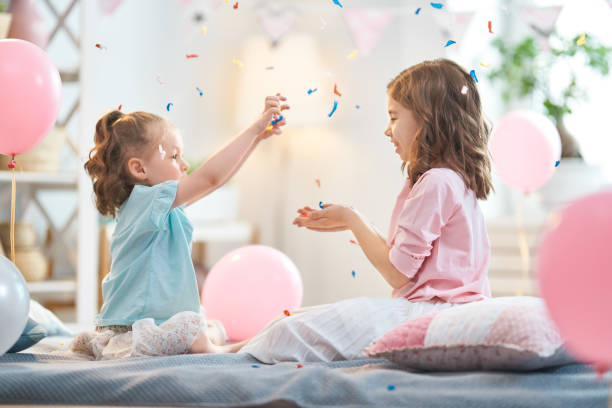 istock Girls are throwing confetti 1154625695