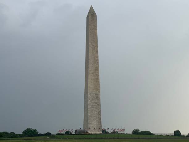 istock Cloudy Skies Over the Washington Monument 1154625761