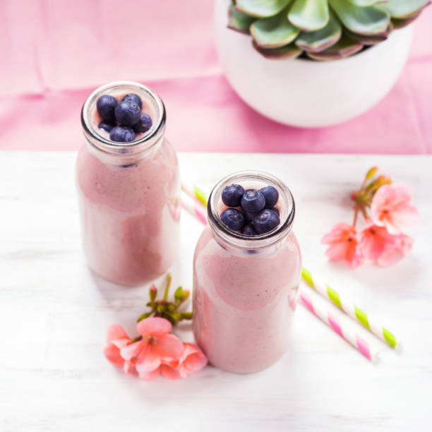 Strawberry banana smoothie topped with berries