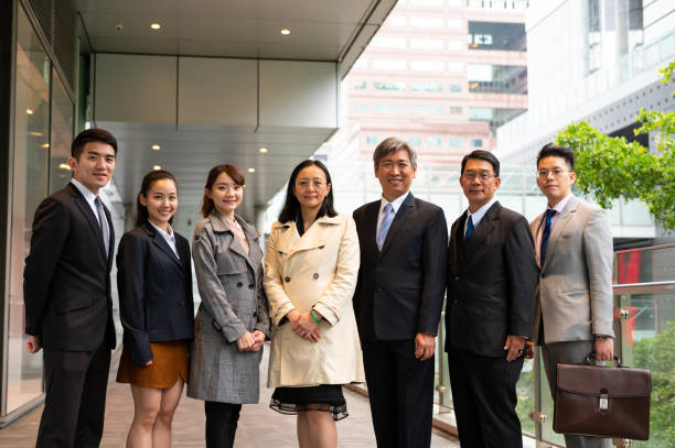 istock Confident business people standing side by side 1154626777