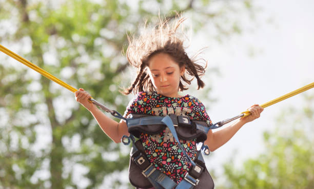 istock Little girl jumping on the bungee 1154627191