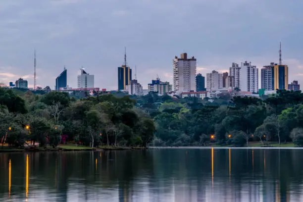 Lake, lots of buildings, trees and Cascavel City, Paraná, Brazil.